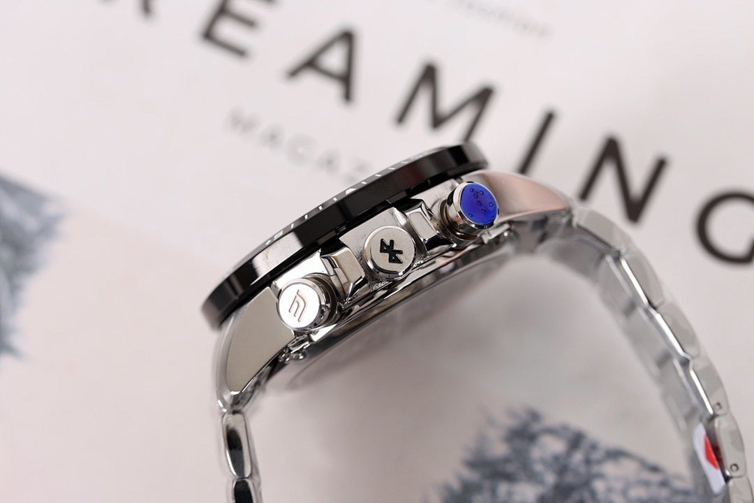 Stainless steel watch side with crown and pushers, black bezel accents