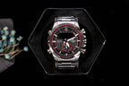 Casio watch on black display with round black dial and red/white subdials