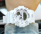Casio watch with white silicone strap, dark digital screen and side buttons