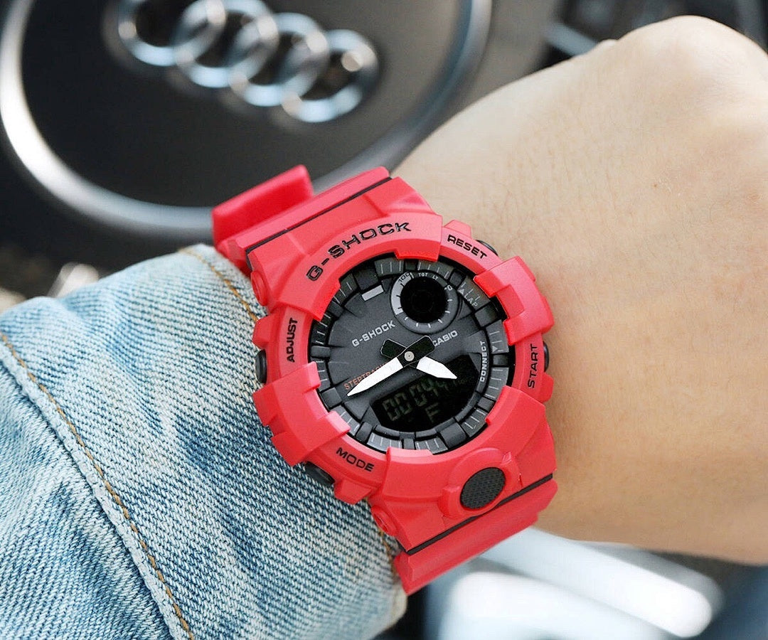 Casio watch with red silicone strap, black dial and red bezel accents
