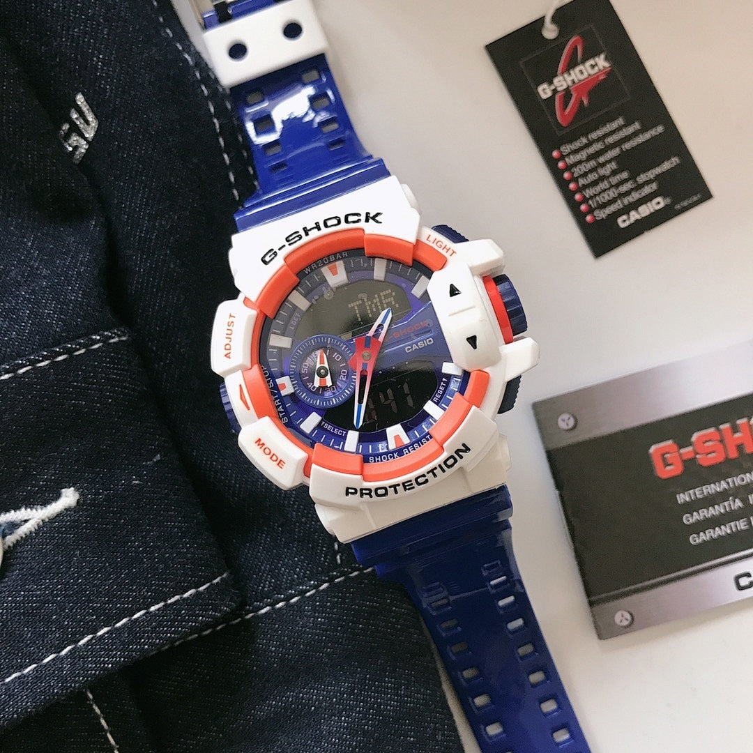 Casio G-Shock watch with blue silicone strap, white case, orange bezel, blue dial