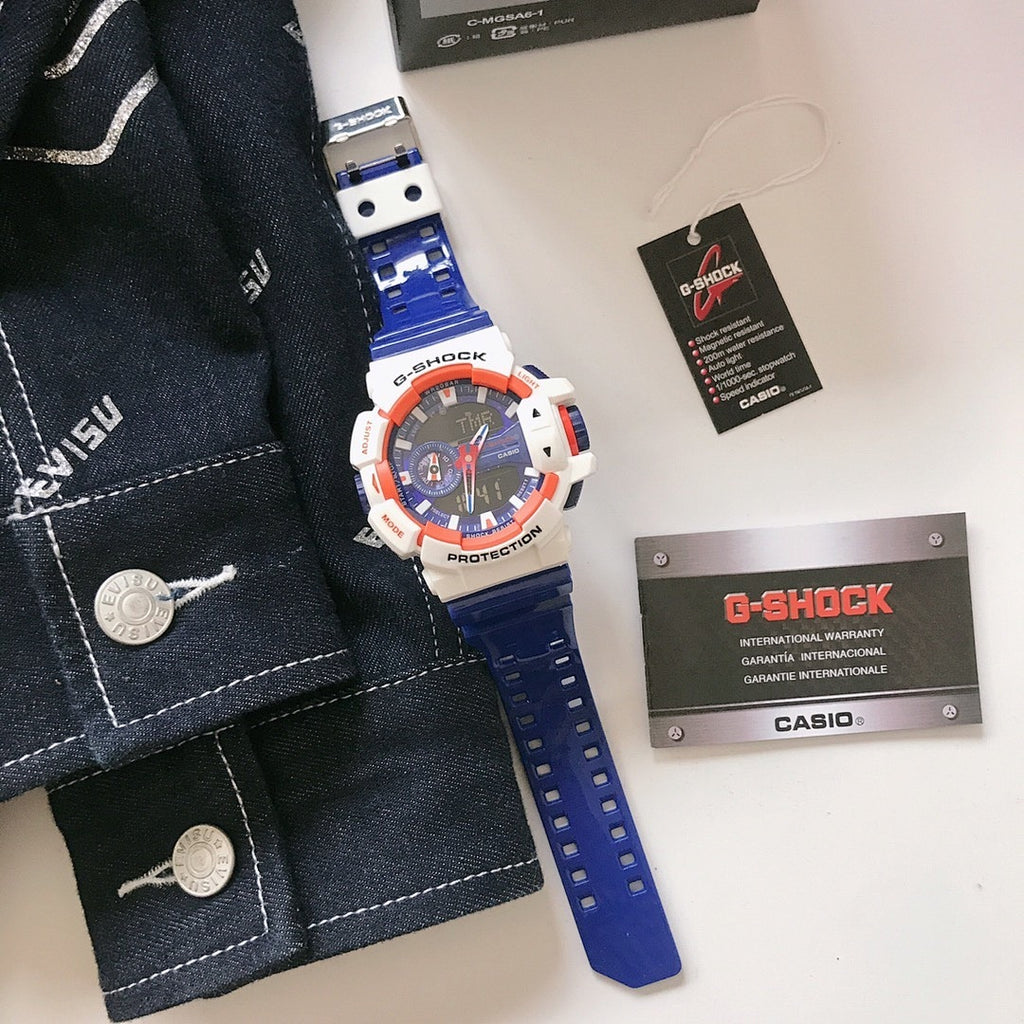 Casio G-Shock watch with blue silicone strap, white bezel and orange accents