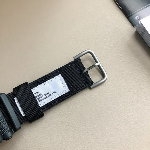 Casio G-Shock watch strap with silver buckle and fabric keeper label