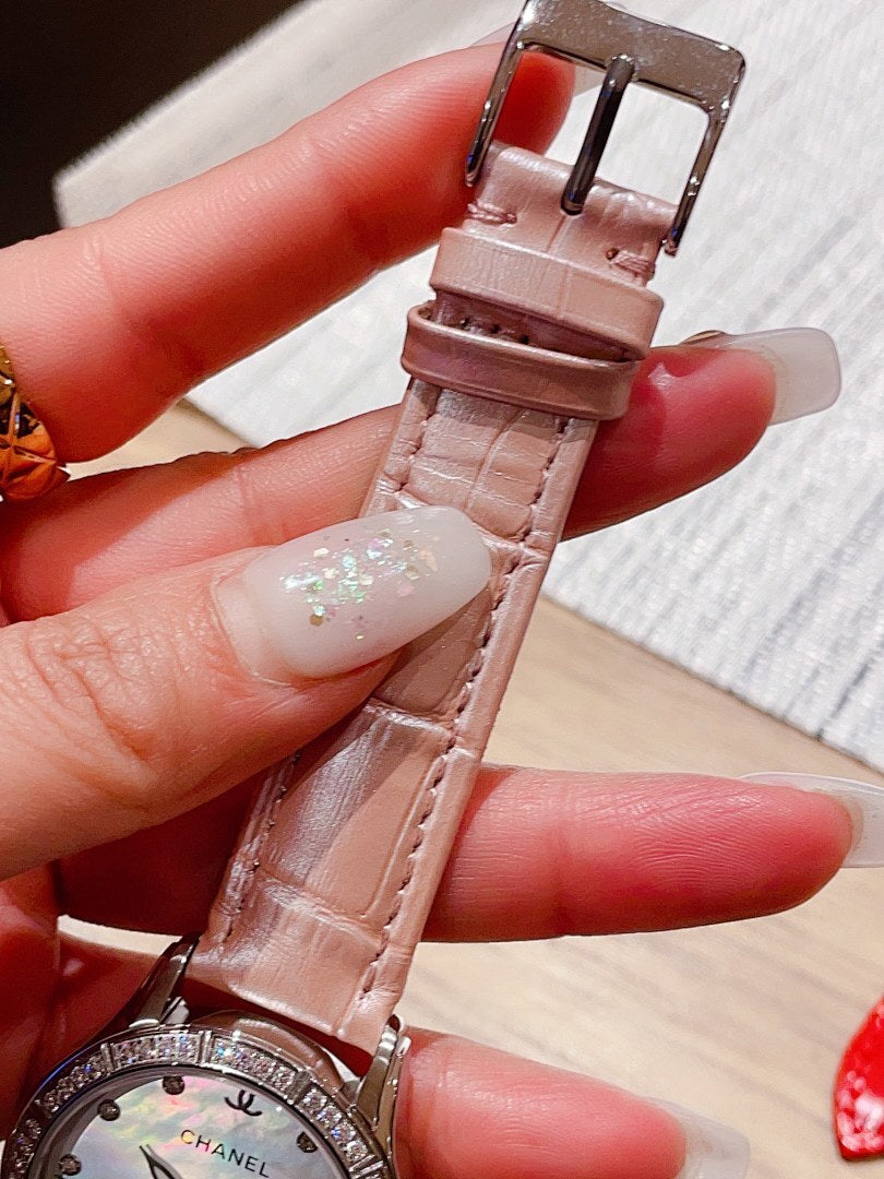 Chanel watch clasp with light pink leather strap and silver buckle hardware