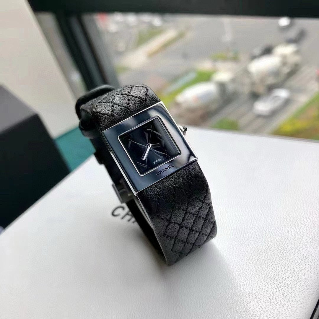 Chanel wristwatch with black leather strap and silver-tone square case, black dial