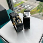 Chanel wristwatches side by side: gold-tone and silver-tone square cases with black straps