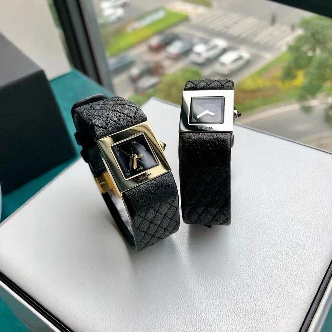 Chanel wristwatches side by side: gold-tone and silver-tone square cases with black straps