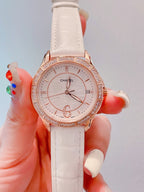 Chanel wrist watch with white leather strap and jeweled rose-gold bezel, white dial