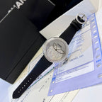 Chanel round wristwatch with black leather strap and silver-tone bezel