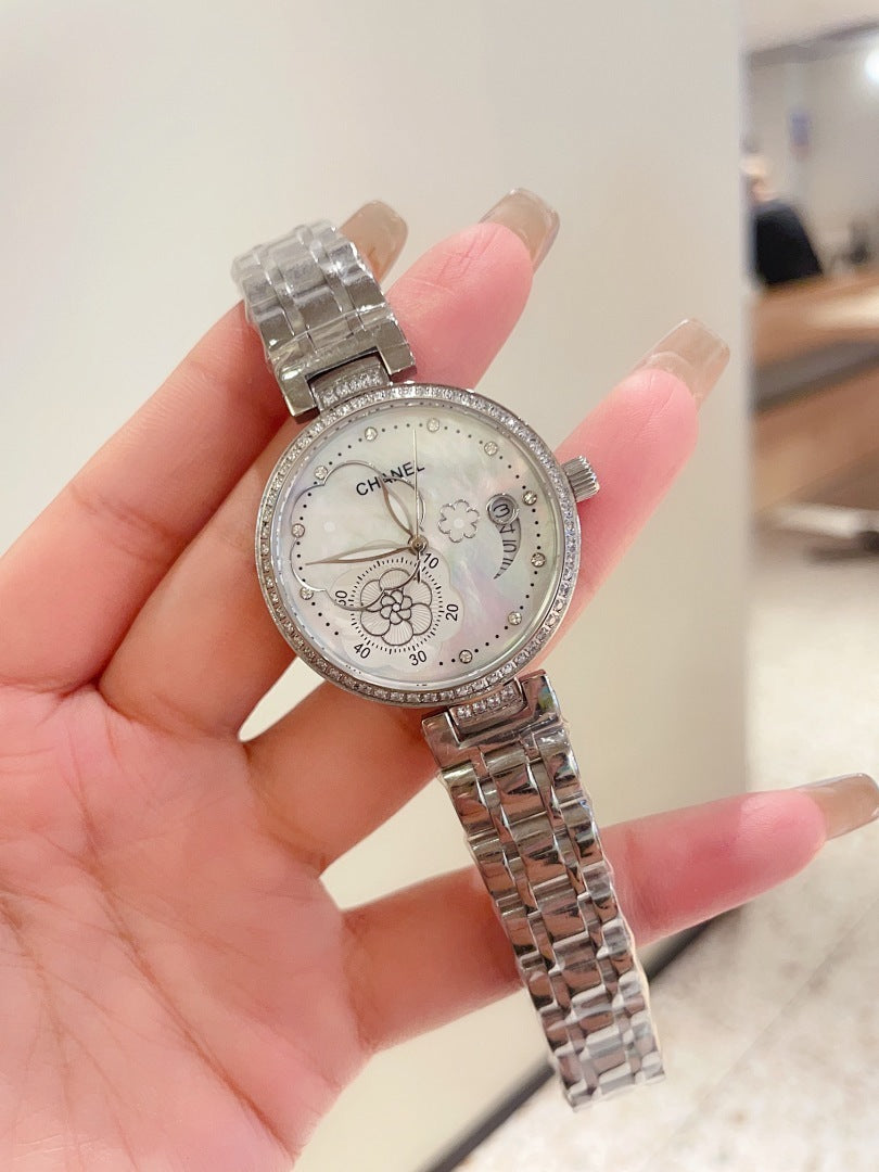 Chanel watch with silver-tone case and sparkling bezel, silver metal link bracelet