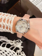 Chanel watch with pale pink leather strap, silver floral dial