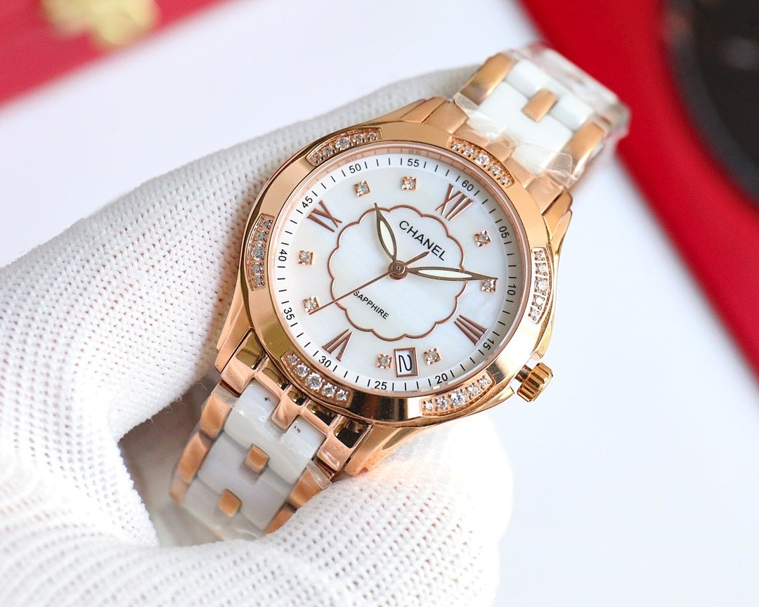 Rose gold Chanel watch with white dial, clover motif, Roman numerals, diamond bezel.