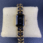 Gold-tone octagonal watch with navy blue and gold chain bracelet, dark dial with Chanel