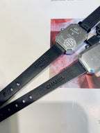 Chanel watch with black leather strap, clasp, and QC Passed marking