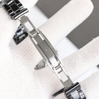 Chanel automatic watch case and steel bracelet links, side profile on white glove