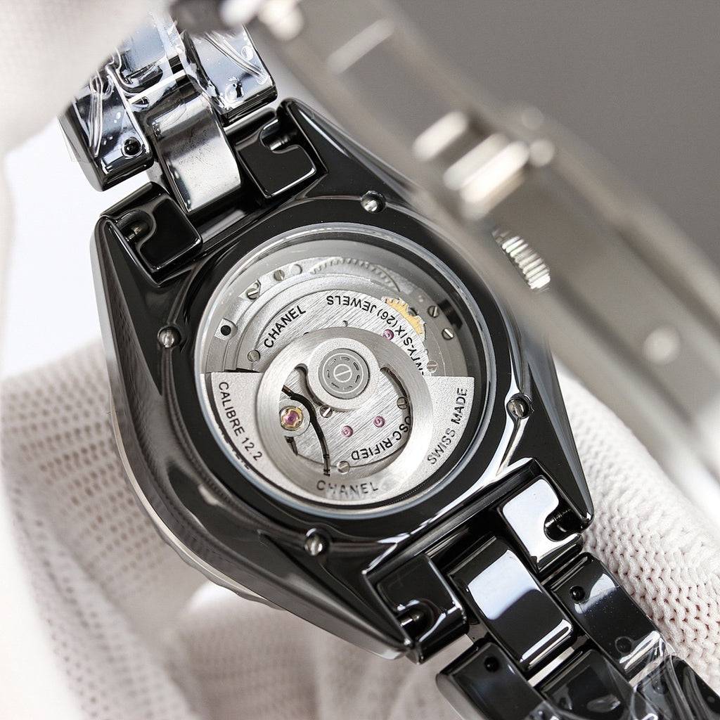 Chanel automatic wristwatch back view, stainless case with engraved details
