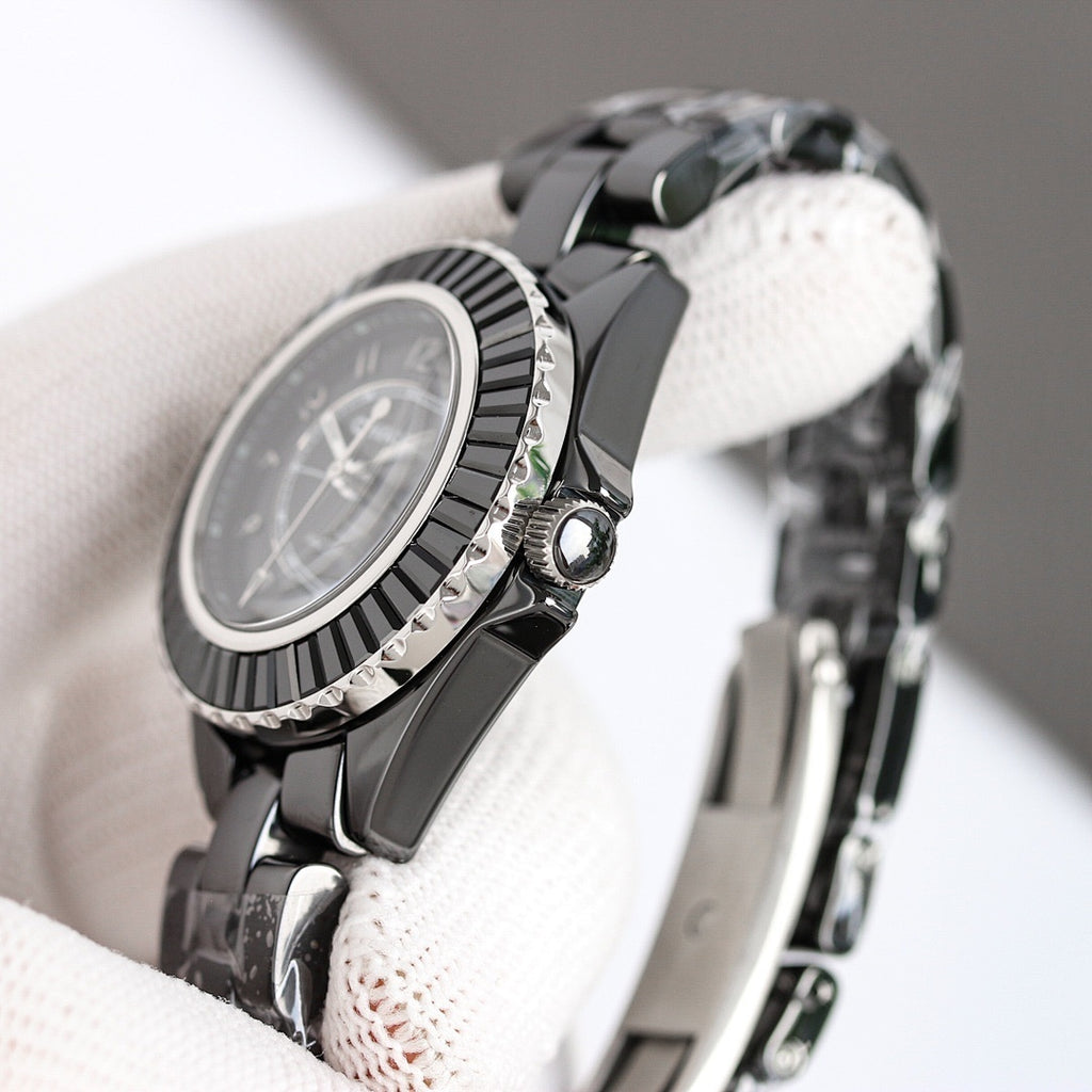 Chanel automatic wristwatch side view, black bezel and crown with steel bracelet