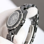 Chanel automatic wristwatch side view, black bezel and crown with steel bracelet