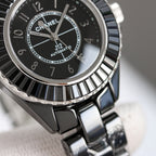 Chanel automatic wristwatch close-up of black dial, silver hands and bezel
