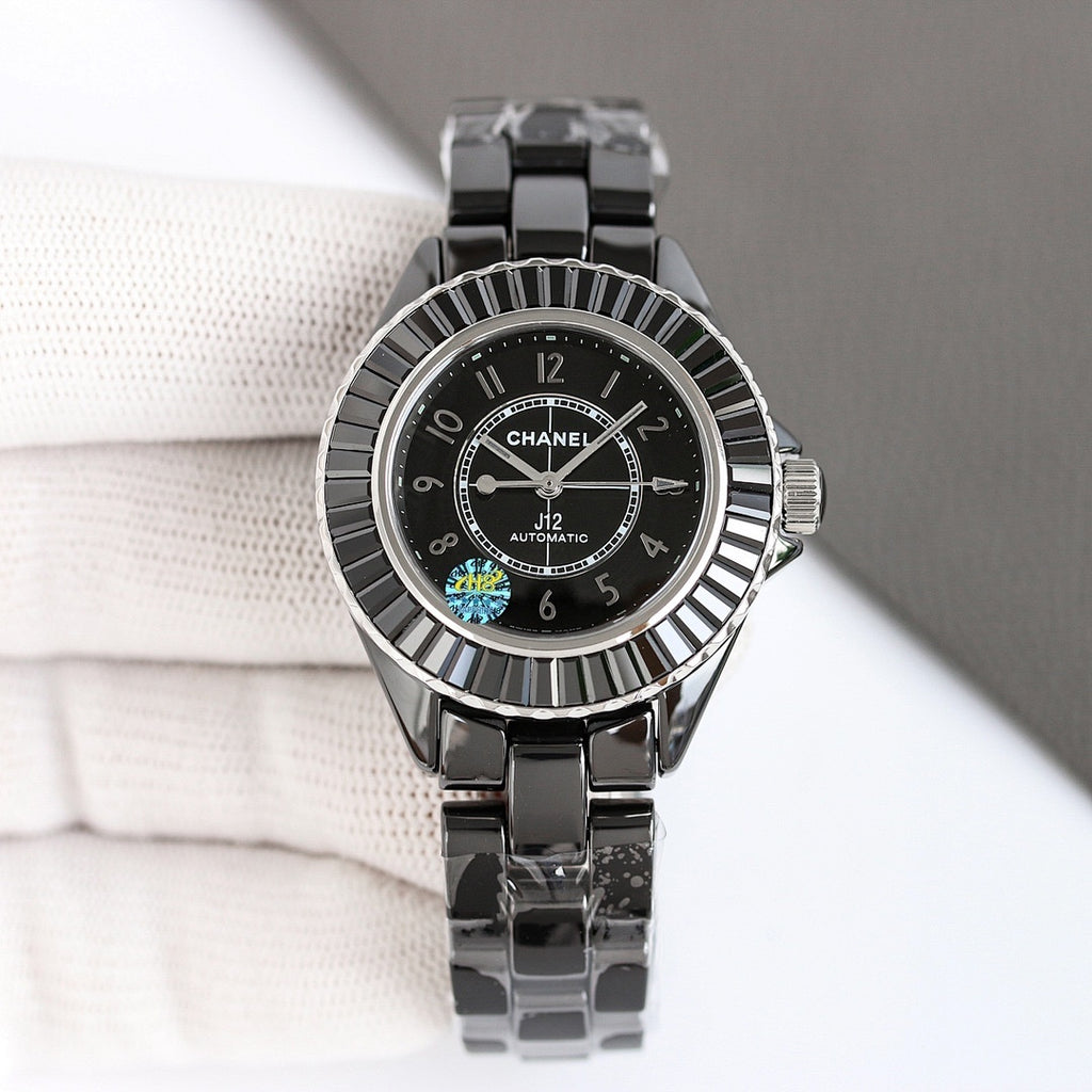 Chanel automatic wristwatch with black dial and steel bracelet, ribbed bezel