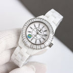 Chanel watch with white ceramic strap, silver-tone jeweled bezel, round white dial view.