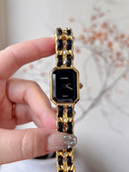 Chanel watch with black dial, gold-tone octagonal case, and linked bracelet