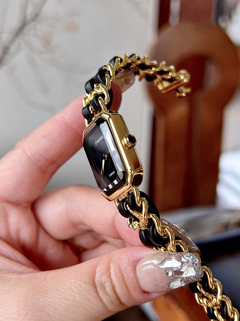 Chanel watch with gold-tone case and chain bracelet, side view on wrist