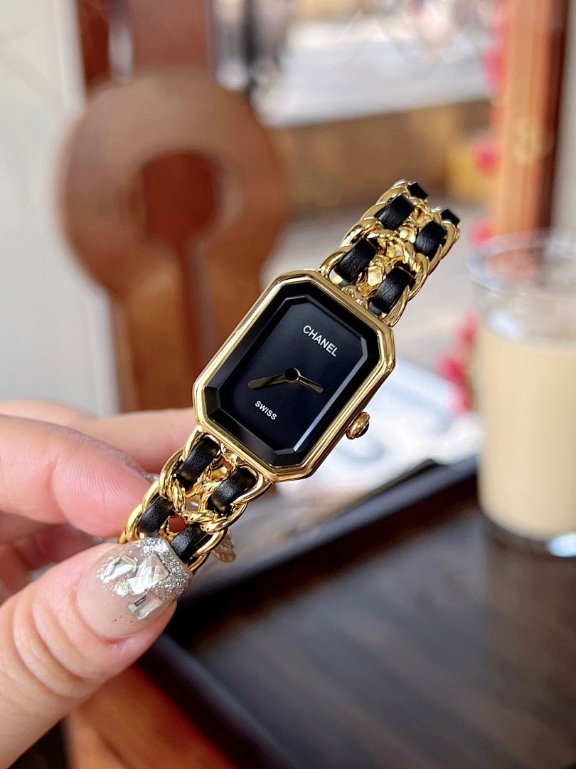 Chanel watch on gold-tone link bracelet with black dial and gold-tone details