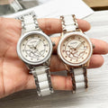 Pair of Chanel watches with white metal bracelets and floral dials; silver-tone and rose-gold