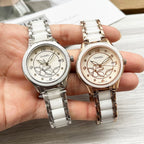 Pair of Chanel watches with white metal bracelets and floral dials; silver-tone and rose-gold