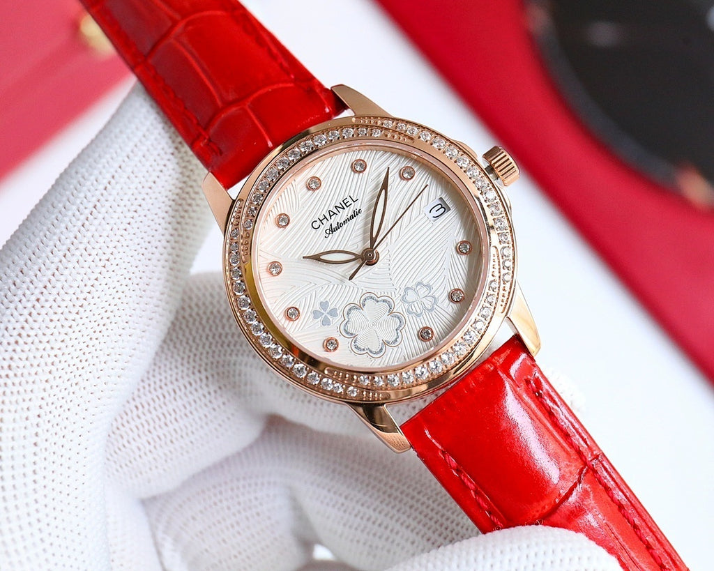 Chanel watch with red leather strap, rose-gold round case, diamond bezel, floral dial
