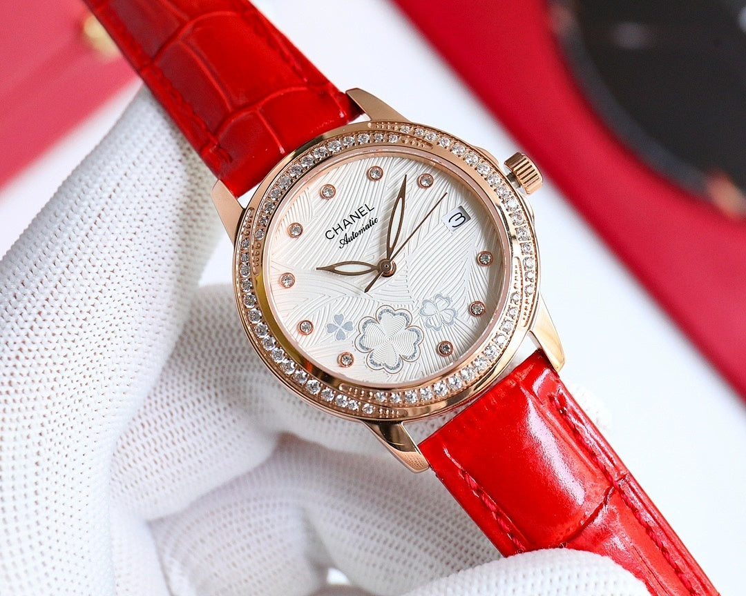 Chanel watch with red leather strap, rose-gold round case, diamond bezel, floral dial