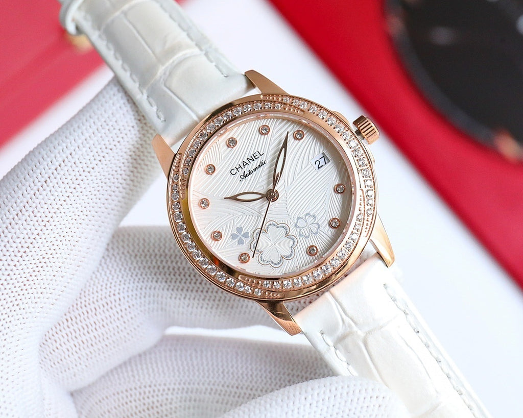 Chanel watch with white leather strap, rose-gold round case, diamond bezel, floral dial