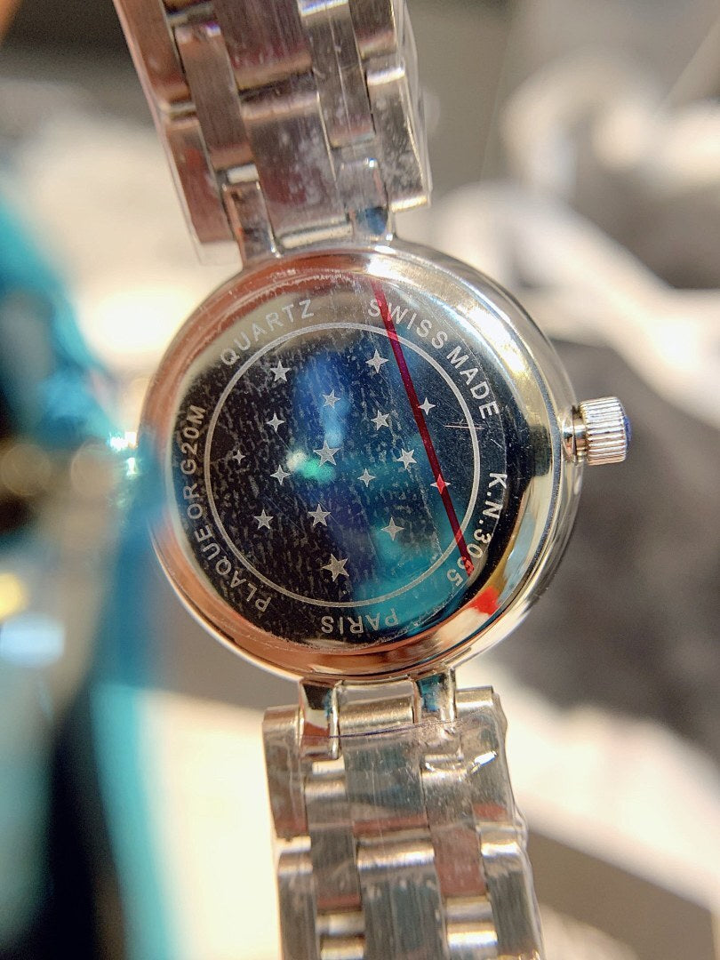Chanel wristwatch case back with stars and the text “SWISS MADE”