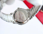 Wristwatch case back with engraved text, stainless steel finish, on link bracelet