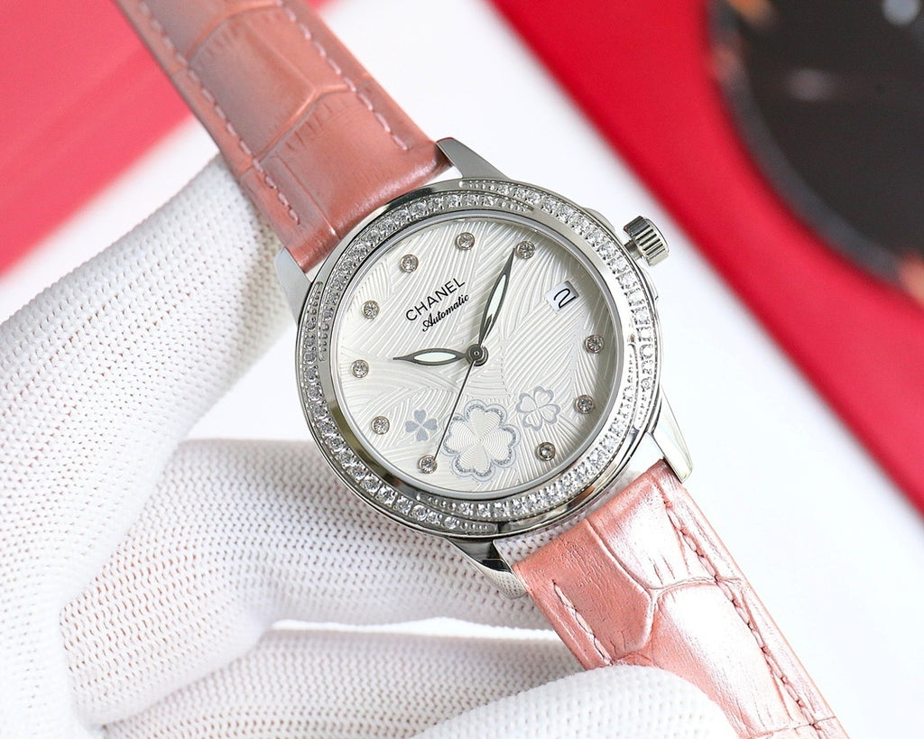 Wristwatch with tan leather strap, diamond bezel, white floral dial