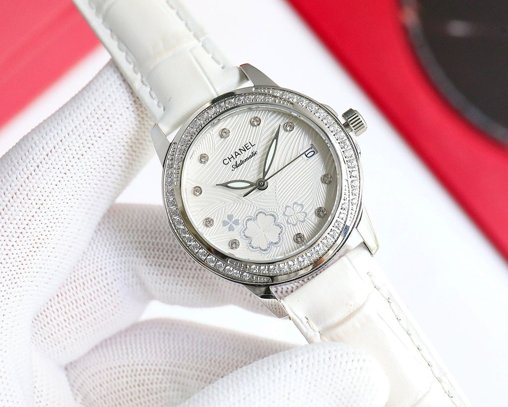 Wristwatch with white leather strap, diamond bezel, white floral dial