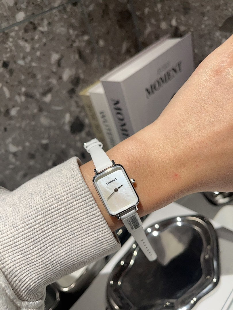 Chanel square-faced wristwatch with white leather strap and light dial