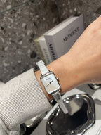 Chanel square-faced wristwatch with white leather strap and light dial