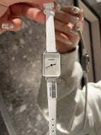 Chanel square-faced wristwatch with white leather strap and light dial