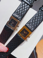Two Chanel watches with black leather straps and gold-tone square dials