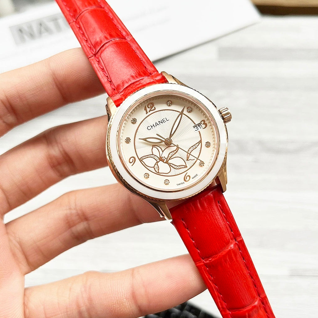 Chanel wristwatch with floral cream dial and red leather strap.