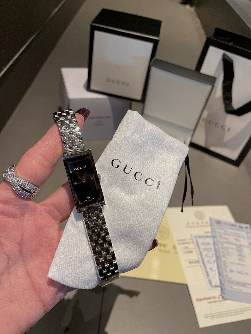Chanel wristwatch on hand, silver bracelet and black dial with metal case