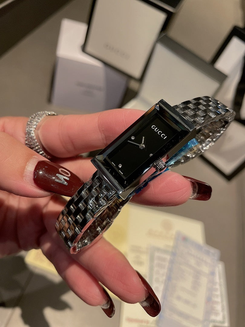 Chanel wristwatch with silver metal bracelet and black rectangular dial