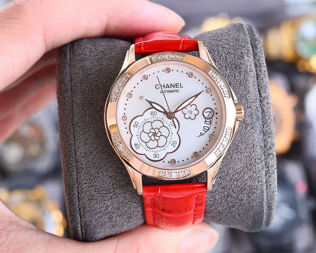 Chanel watch with red leather strap, round white dial and rose-gold tone case