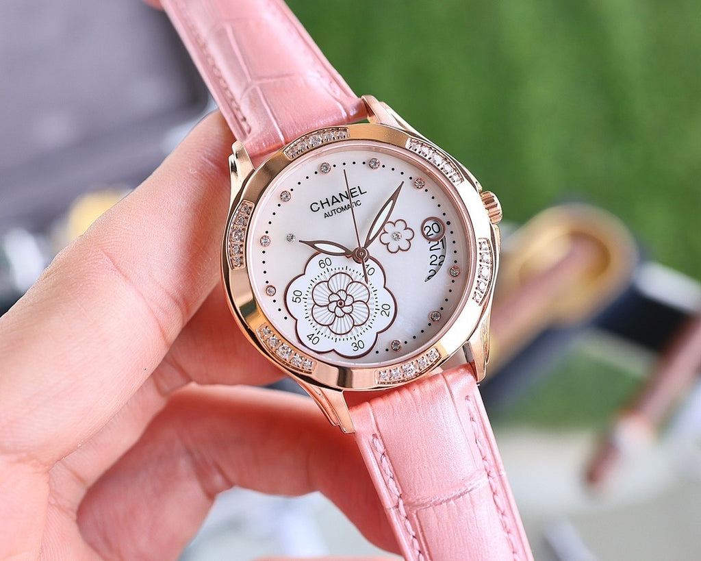 Chanel watch with pink leather strap, rose-gold tone case and round white dial