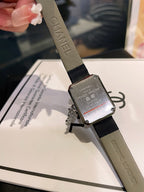 Chanel square watch with silver-tone textured dial and black leather strap
