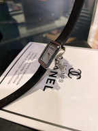 Chanel silver-tone square watch with black leather strap and textured dial