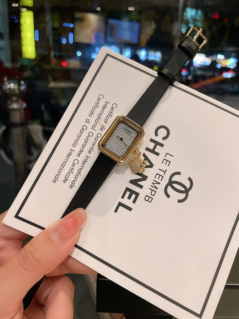 Chanel gold-tone square watch on black leather strap, with textured dial