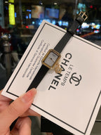 Chanel gold-tone square watch on black leather strap, with textured dial
